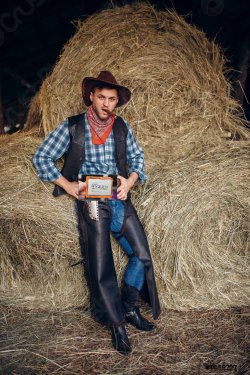 brutal-cowboy-poses-with-cigar-1455727.jpg